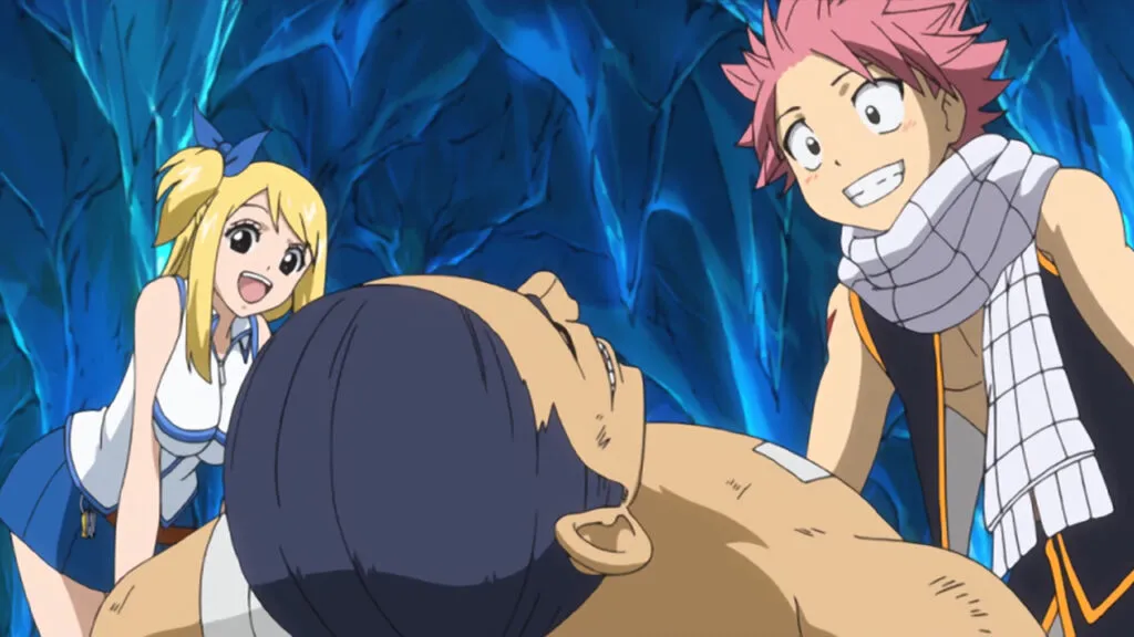 Lucy and Natsu stare down at Macao, smiling and happy that he woke up in the icy cave.
