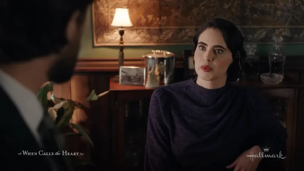 Conflicted Conversation: A woman in a vintage blue dress expresses concern during a tense discussion in a dimly lit office, hinting at the intricate dynamics of the conversation.