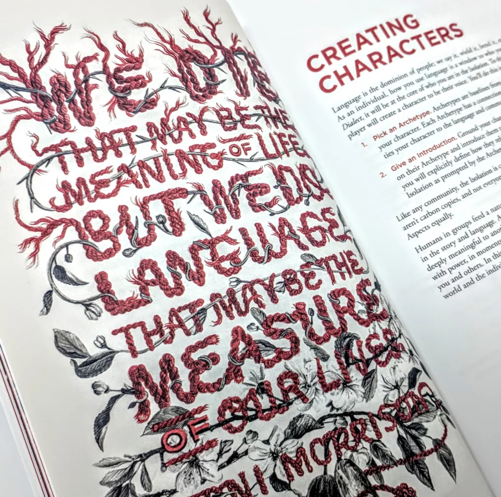 An open book with the title "Creating Characters" shows detailed text and illustrations. The left page features an intricate, red and black design resembling vines and roots, forming the quote: "We die. That may be the meaning of life, but we use language. That may be the measure of our lives." The right page contains text outlining steps for creating characters in the role-playing game indie TTRPG "Dialect," emphasizing the importance of language in defining the community's identity and story.