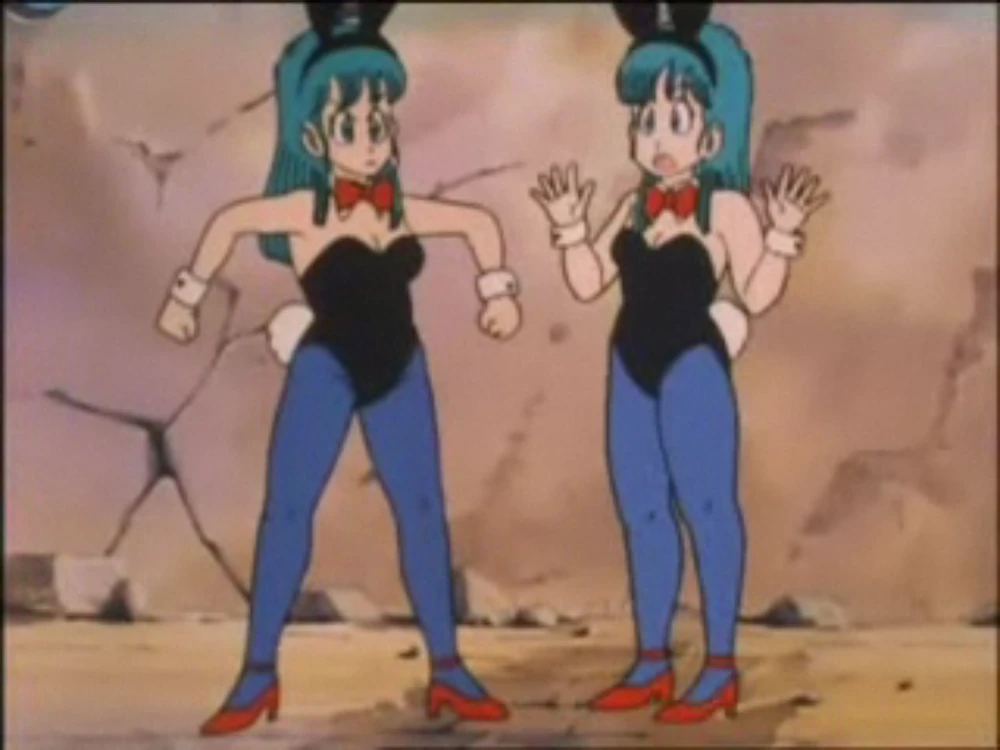 Bulma looks absolutely baffled as she comes face-to-face with her duplicate, both dressed as bunnies, proving Dragon Ball humor always hits the mark!