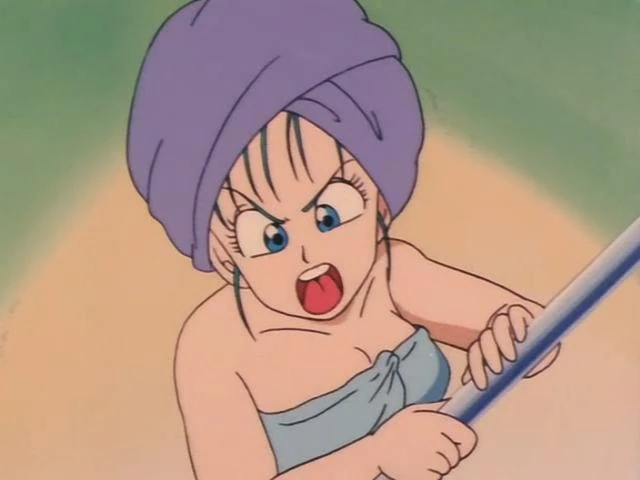 A comedic moment from Dragon Ball featuring Bulma wrapped in a towel with a purple towel turban on her head. She appears angry and is mid-shout, holding what looks like a pole or stick with both hands. Her wide blue eyes and open mouth emphasize her frustration or outrage. The background is a soft blend of green and beige, keeping the focus on her expression. This scene captures Bulma's fiery and spirited personality in a classic Dragon Ball humorous situation.