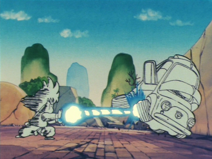 Goku unleashes a powerful Kamehameha, sending a truck flying in classic Dragon Ball fashion. The legend begins!