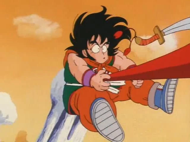 Yamcha finds himself in a tight spot as Goku's Power Pole strikes! Catch the action-packed reaction to Dragon Ball Episode 5 on All Ages of Geek!