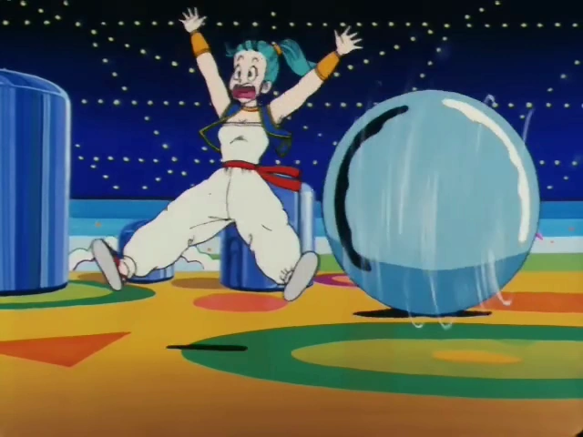 Bulma runs with a panicked expression, arms raised, as a giant blue pinball rolls toward her inside a brightly colored pinball machine arena with a starry background