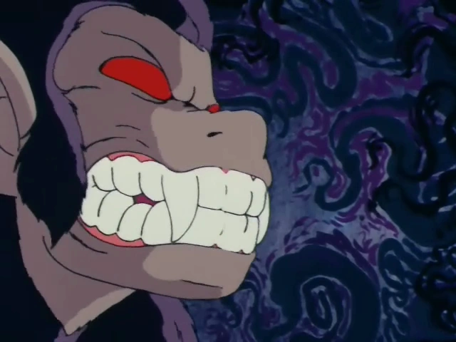 A close-up of Goku's Great Ape transformation, showing his snarling face with sharp teeth and glowing red eyes. The background is dark and swirling with chaotic purple and black patterns, emphasizing the intense and ominous moment.