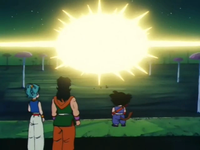 Bulma, Yamcha, and Goku stand together, watching a massive, glowing explosion of light on the horizon. The scene is set against a dark night sky with mushroom-like trees in the distance.