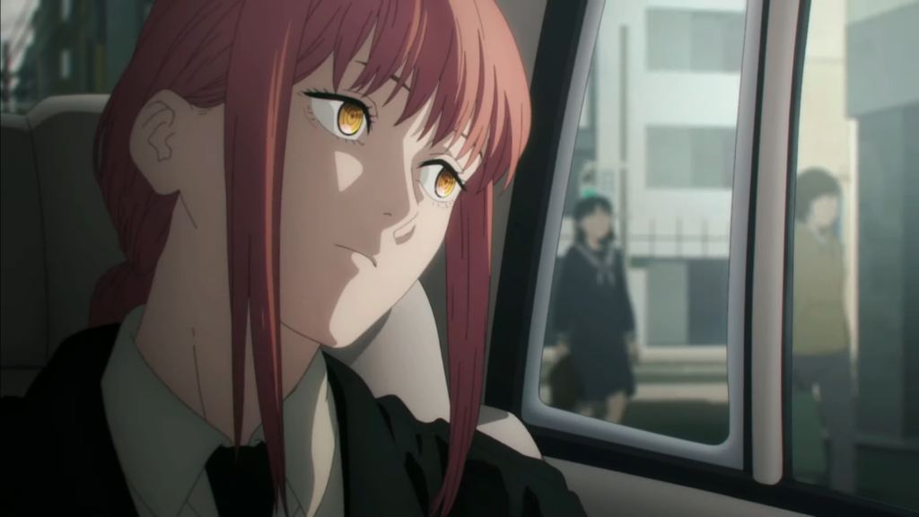 Makima from Chainsaw Man gazes out the car window with a calm yet mysterious expression, her golden eyes reflecting light as she observes the world outside.