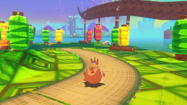 Bubsy runs along a colorful yarn-themed path surrounded by giant spools in a bright, whimsical world from Bubsy 4D.