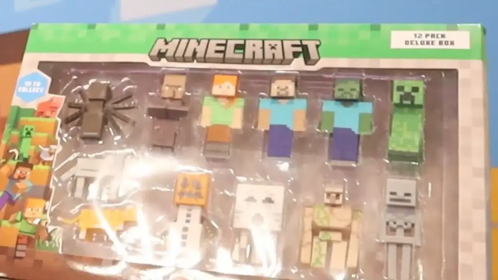 Minecraft 12-pack deluxe collectible figure set displayed at the Toy Fair NY 2025 PMI Kids World showcase, featuring Steve, Alex, and classic mobs like Creepers and Zombies in signature pixelated style.