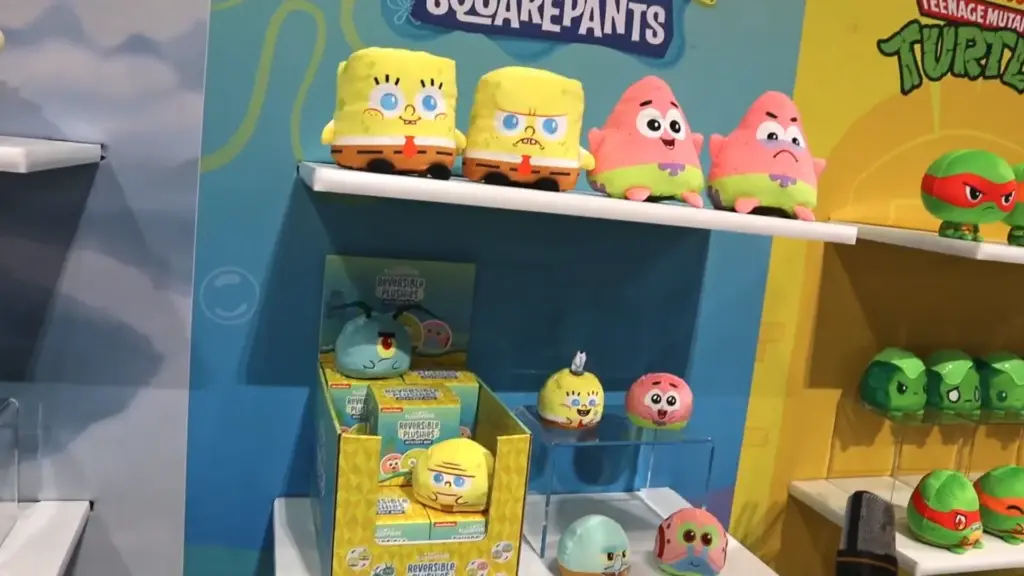 A TeeTurtle display featuring SpongeBob SquarePants and Patrick reversible plushies alongside smaller collectible plush versions of SpongeBob, Patrick, and Plankton at Toy Fair NY 2025.