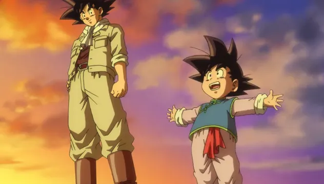 Goku standing calmly beside young Goten, who has his arms spread wide with excitement, both silhouetted against a warm sunset sky with orange and purple clouds.
