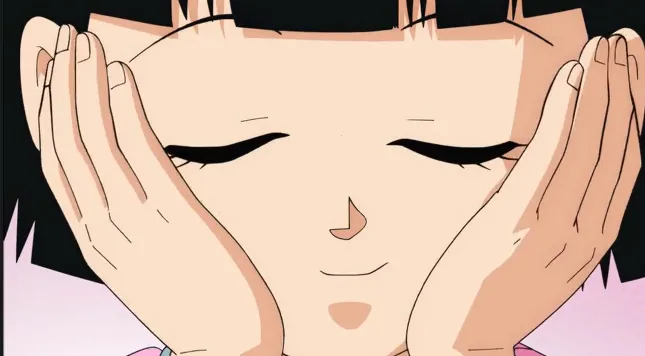Videl smiling softly with her eyes closed, resting her face in her hands, looking calm and content.