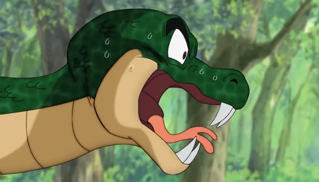 A large green snake with its mouth wide open, fangs visible and tongue out, sweating and looking shocked or frightened in a forest setting.