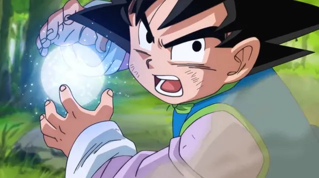 Goten holding a glowing energy sphere in his hands with a determined expression, preparing an attack while standing in a forest setting.