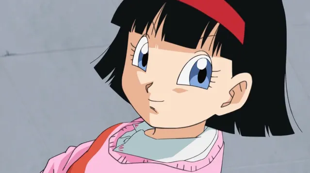 Close-up of Videl with short black hair and a red headband, wearing a pink sweater and light blue shirt, looking upward with a soft, curious expression.