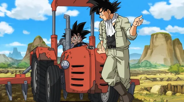 Goku stands beside a red tractor in a farm field, pointing as he talks to Goten who sits in the driver’s seat, with rocky hills and blue sky in the background.