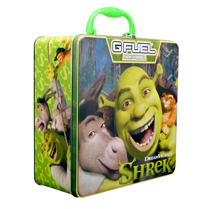 Shrek collector’s lunch box from G FUEL featuring Shrek, Donkey, and Puss in Boots artwork with bright green carrying handle and swamp-themed graphics.